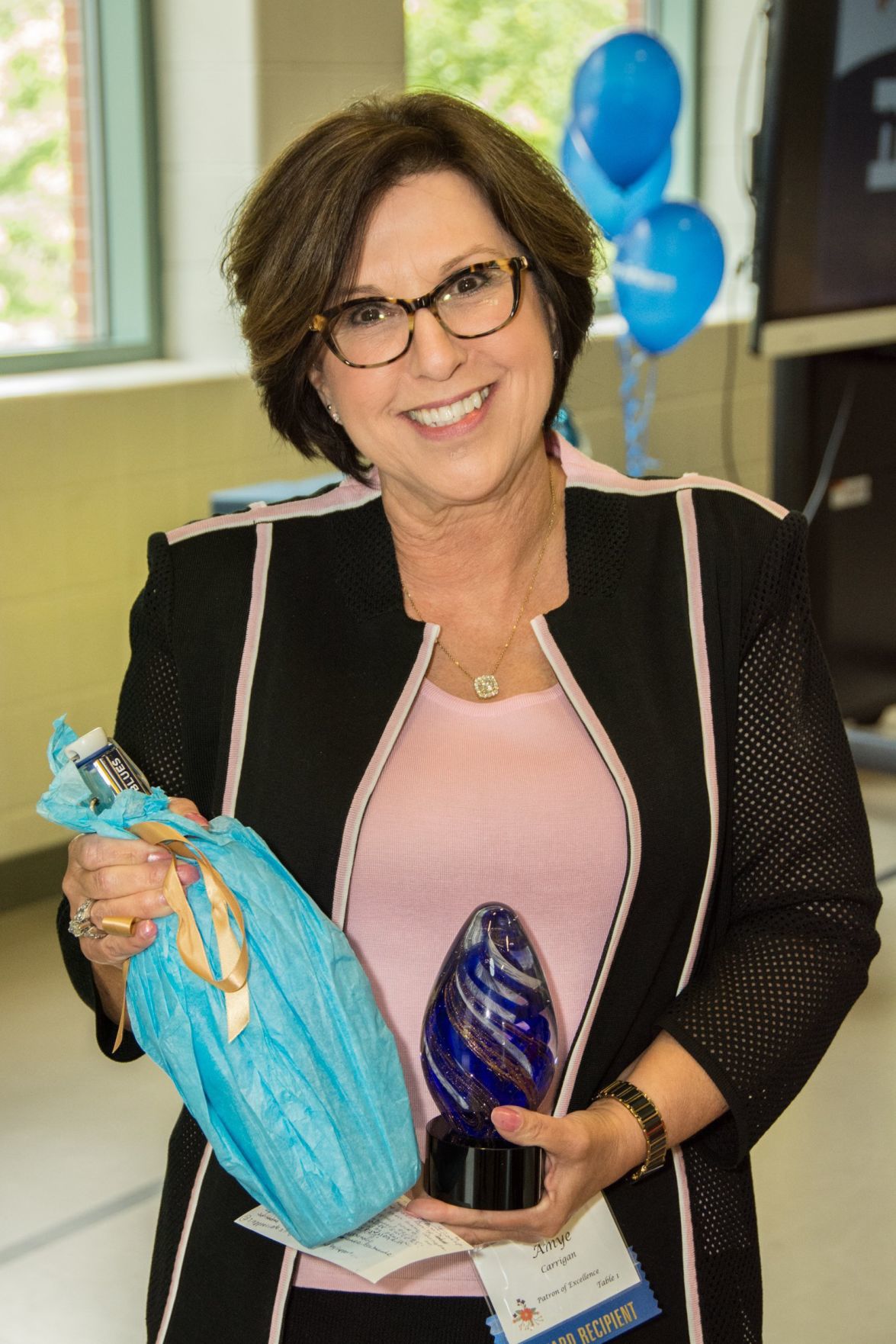 Amye Carrigan with her award and special gift at the Friends of Miriam Luncheon